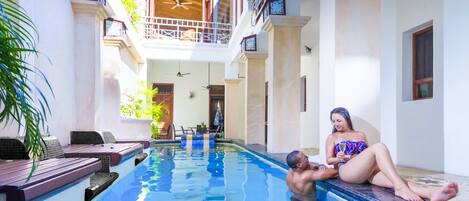 Outdoor pool, open 8 AM to 10:00 PM, pool umbrellas, sun loungers