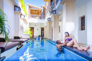 Outdoor pool, open 8 AM to 10:00 PM, pool umbrellas, pool loungers