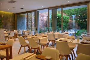 Breakfast, lunch, dinner served; Argentinean cuisine, garden views 