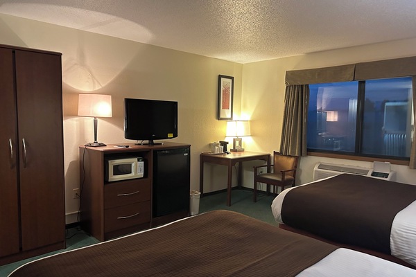 Economy Room | Pillowtop beds, desk, laptop workspace, blackout drapes