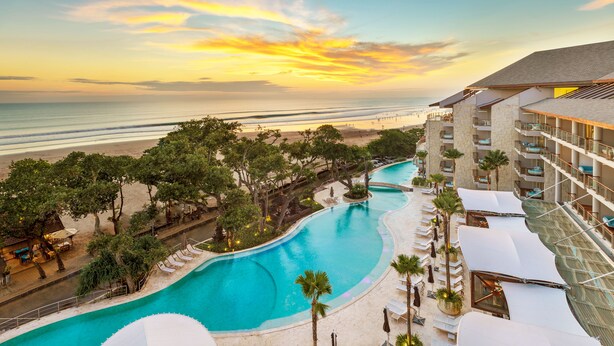 A resort with a swimming pool, beach access, and a view of the ocean. - Double-Six Luxury Hotel (Seminyak)