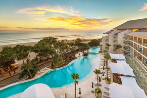 A resort with a swimming pool, beach access, and a view of the ocean. - Double-Six Luxury Hotel (Seminyak)