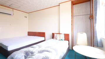 Triple Room, Non Smoking | Desk, blackout drapes, free WiFi, bed sheets