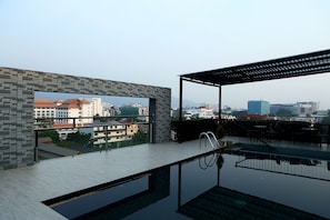 Outdoor pool, open 7:00 AM to 6:00 PM, pool umbrellas, pool loungers