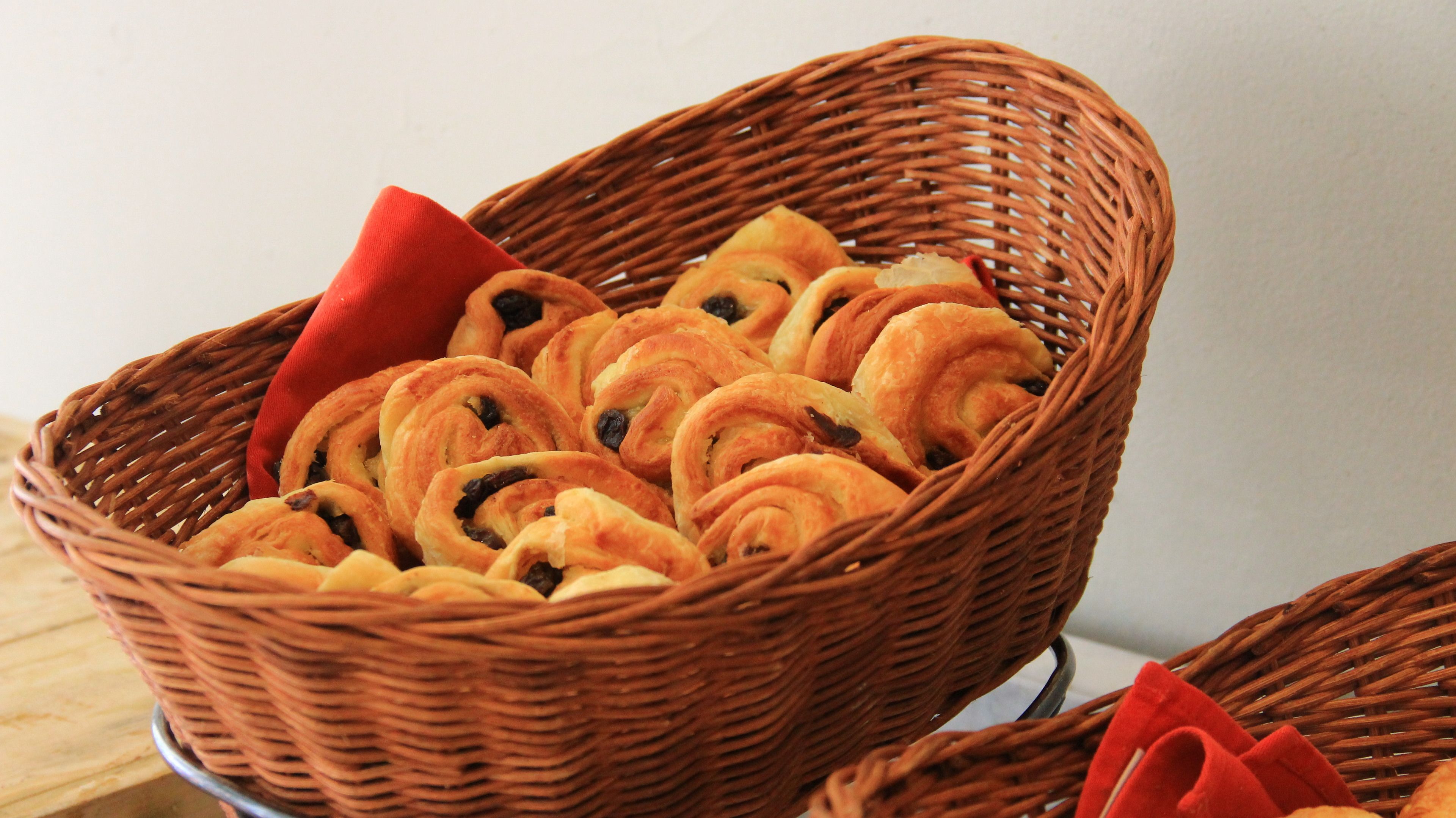 A wicker basket filled with pastries.