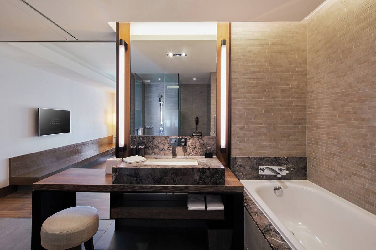 separate bathtub and shower, deep-soaking bathtub, hair dryer, bathrobes