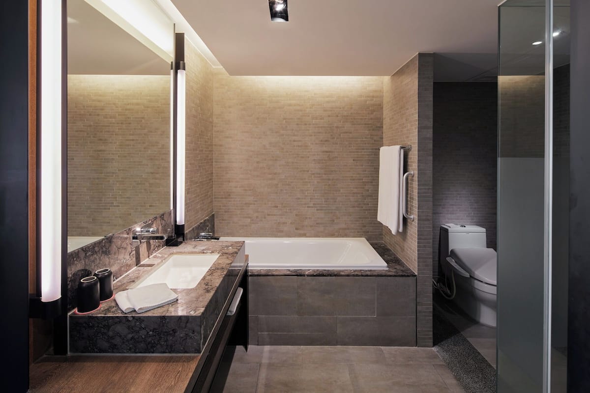 separate bathtub and shower, deep-soaking bathtub, hair dryer, bathrobes