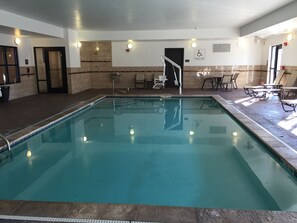 Relax and unwind by the pool, surrounded by comfortable lounge chairs and tables.