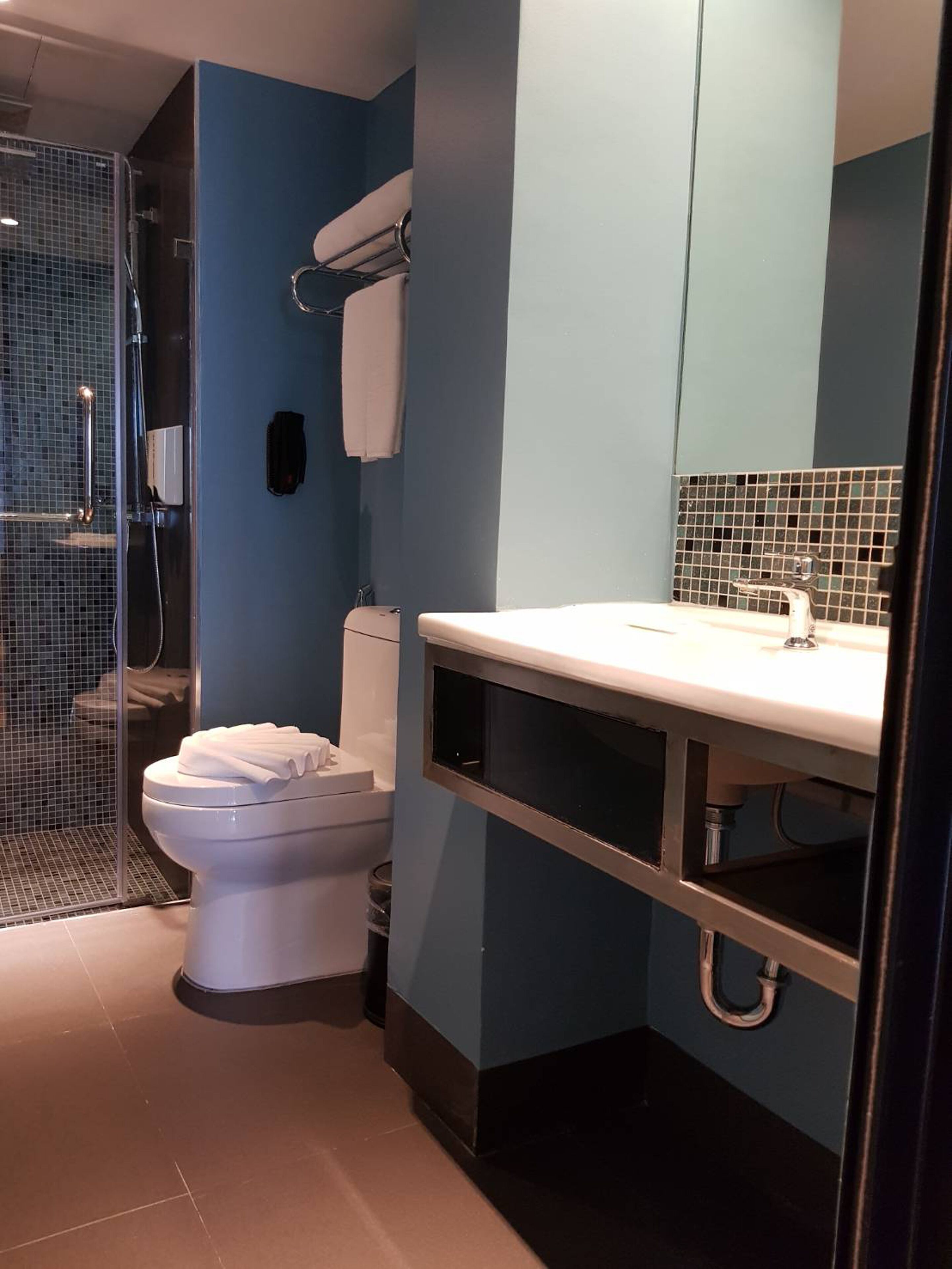 2 bedroom family suite | bathroom | shower, free toiletries, hair dryer, slippers