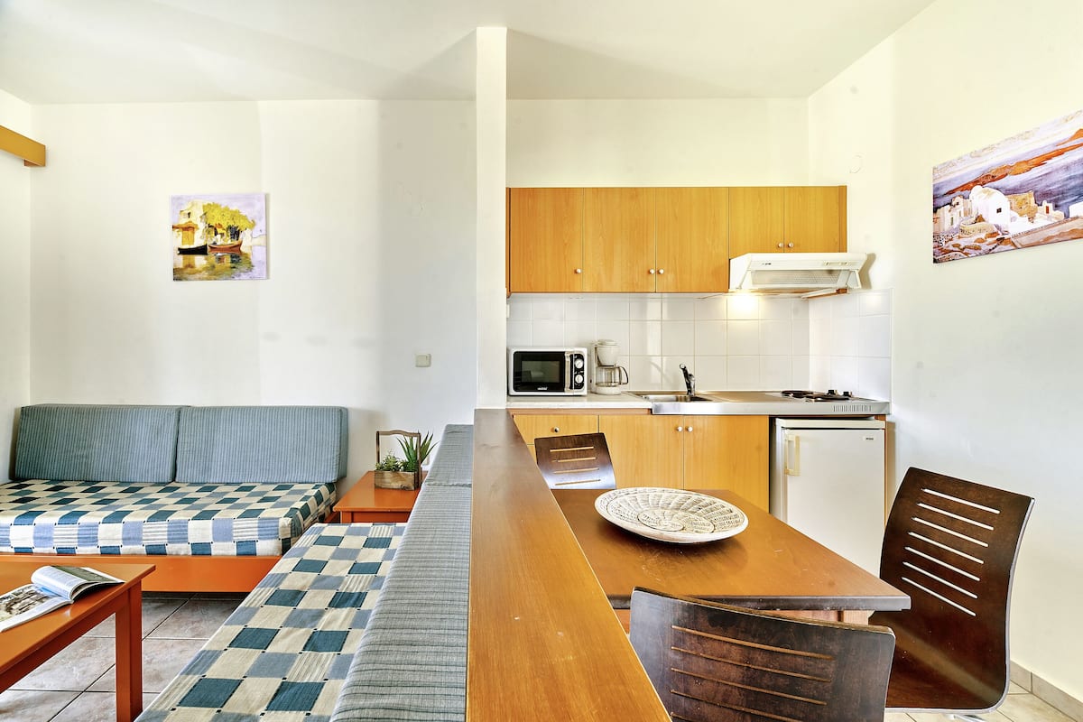 standard apartment, 1 bedroom | living area | 21-inch lcd tv with satellite channels, tv