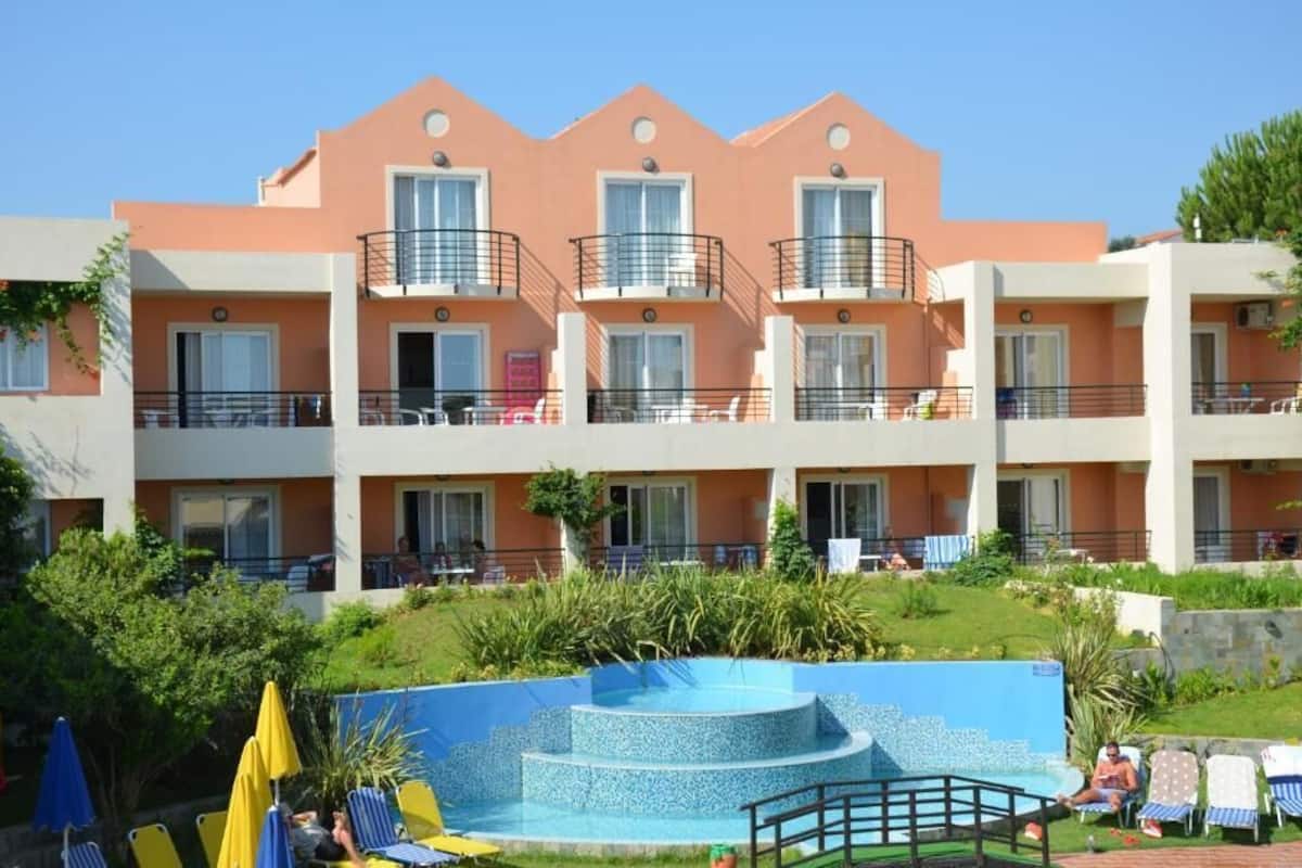 seasonal outdoor pool, pool umbrellas, pool loungers