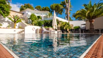 Indoor pool, pool umbrellas, pool loungers