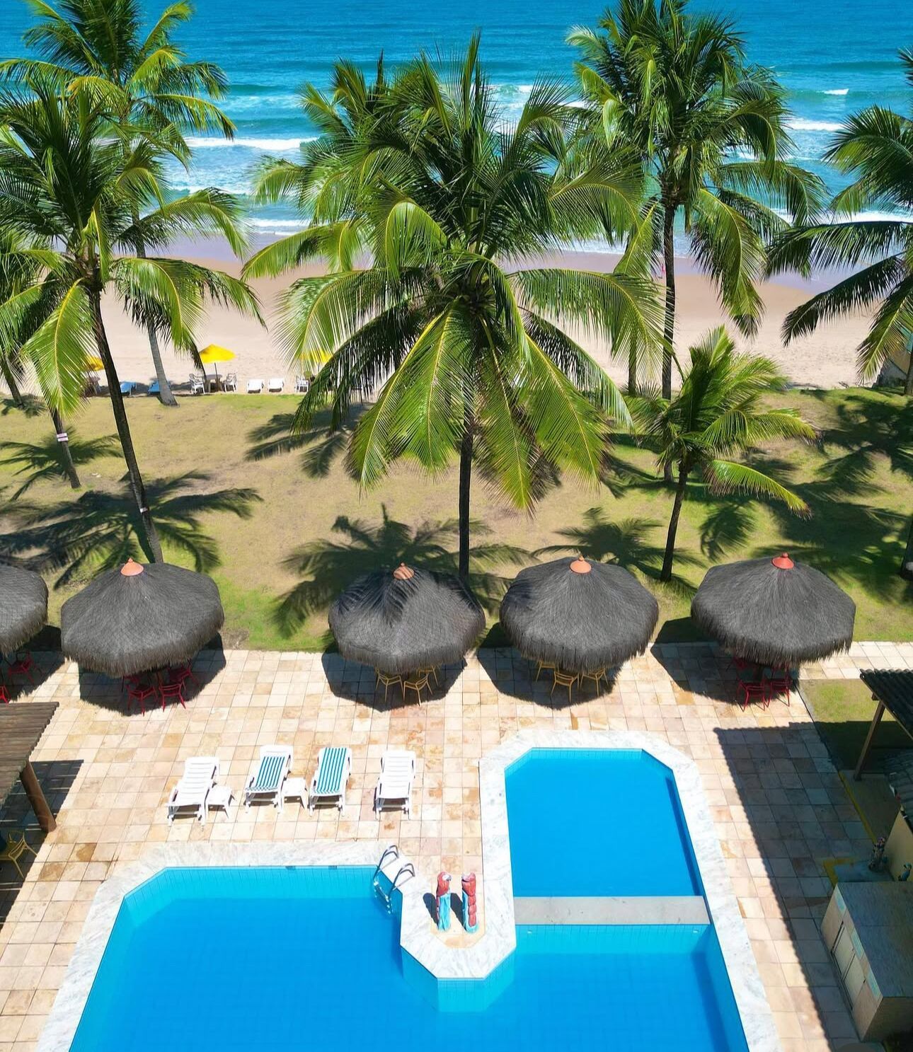 outdoor pool, open 7 am to 10 pm, pool umbrellas, pool loungers