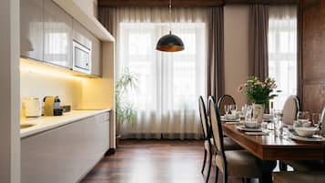 Executive Apartment, Balcony | Private kitchenette | Fridge, coffee/tea maker, electric kettle, paper towels