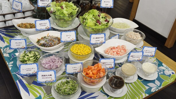 A buffet table with various food items and condiments, each labeled with their names. - EN RESORT Kumejima EEF Beach Hotel (Kumejima)