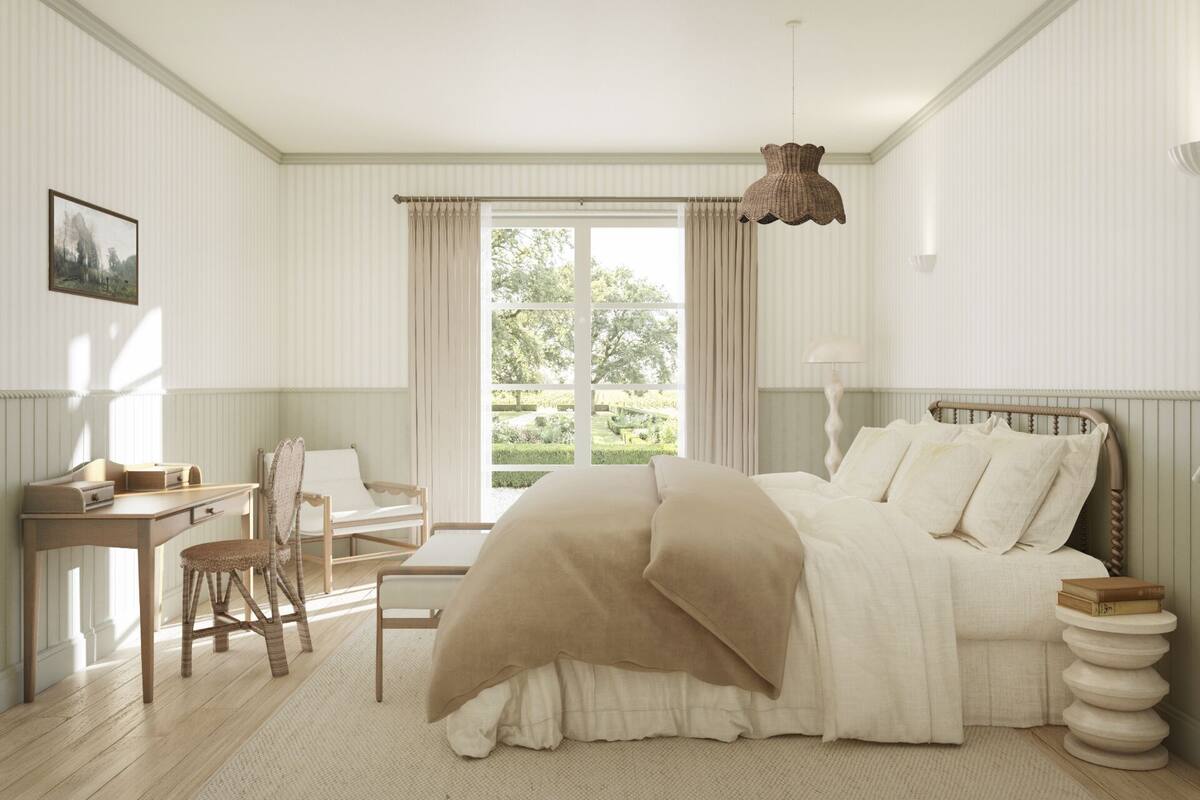 A bedroom with a bed, a desk, a chair, and a window with curtains.