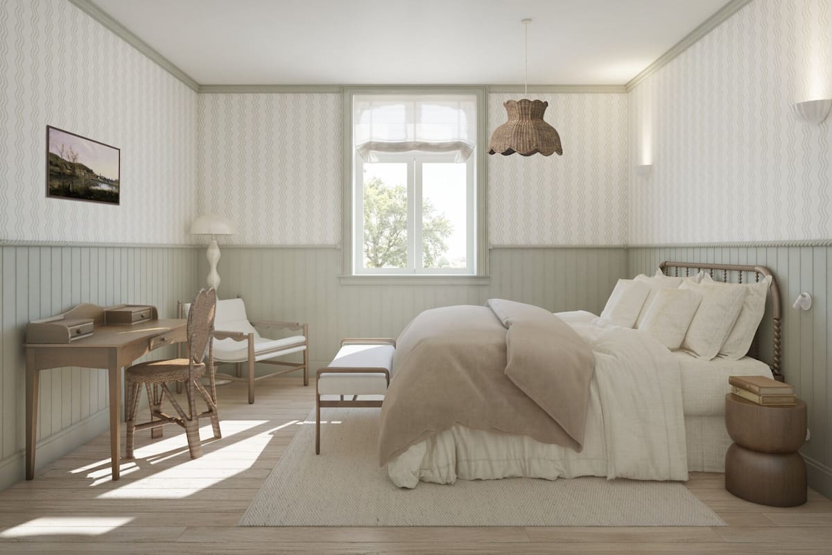 A bedroom with a bed, a desk, a chair, a window, and a hanging light fixture.