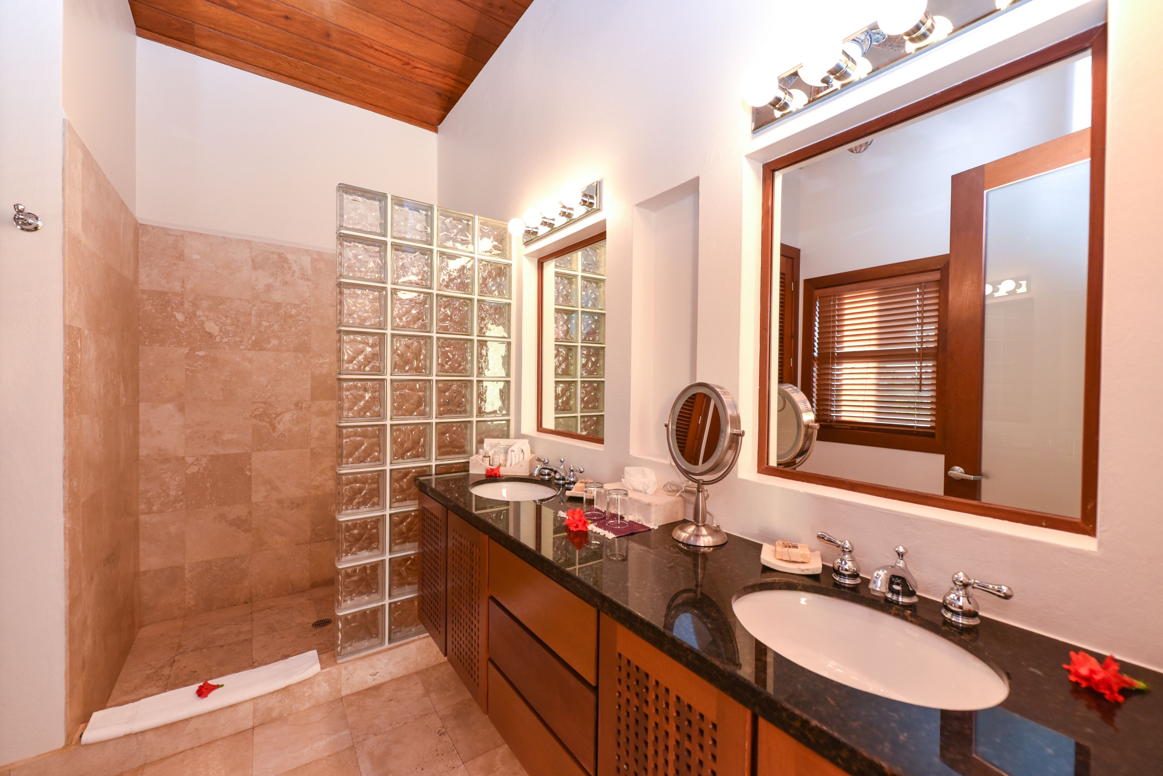 1 bedroom infinity suite | bathroom | shower, designer toiletries, hair dryer, bathrobes