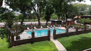 Seasonal outdoor pool, open 9:00 AM to 10:00 PM, pool umbrellas