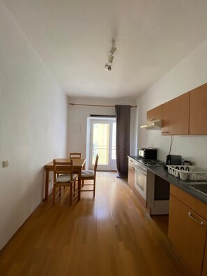 Apartment, 1 Bedroom | Private kitchen | Fridge, coffee/tea maker, cookware/dishes/utensils, dining tables - Hans-Sachs-Gasse 10 (Graz)