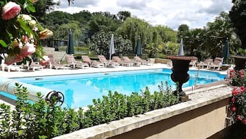 Outdoor pool, a heated pool, sun loungers