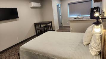 Studio, 1 Queen Bed, No Pets Allowed | Desk, laptop workspace, blackout drapes, iron/ironing board