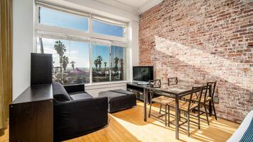 Large Oceanfront Studio | Living room | Flat-screen TV