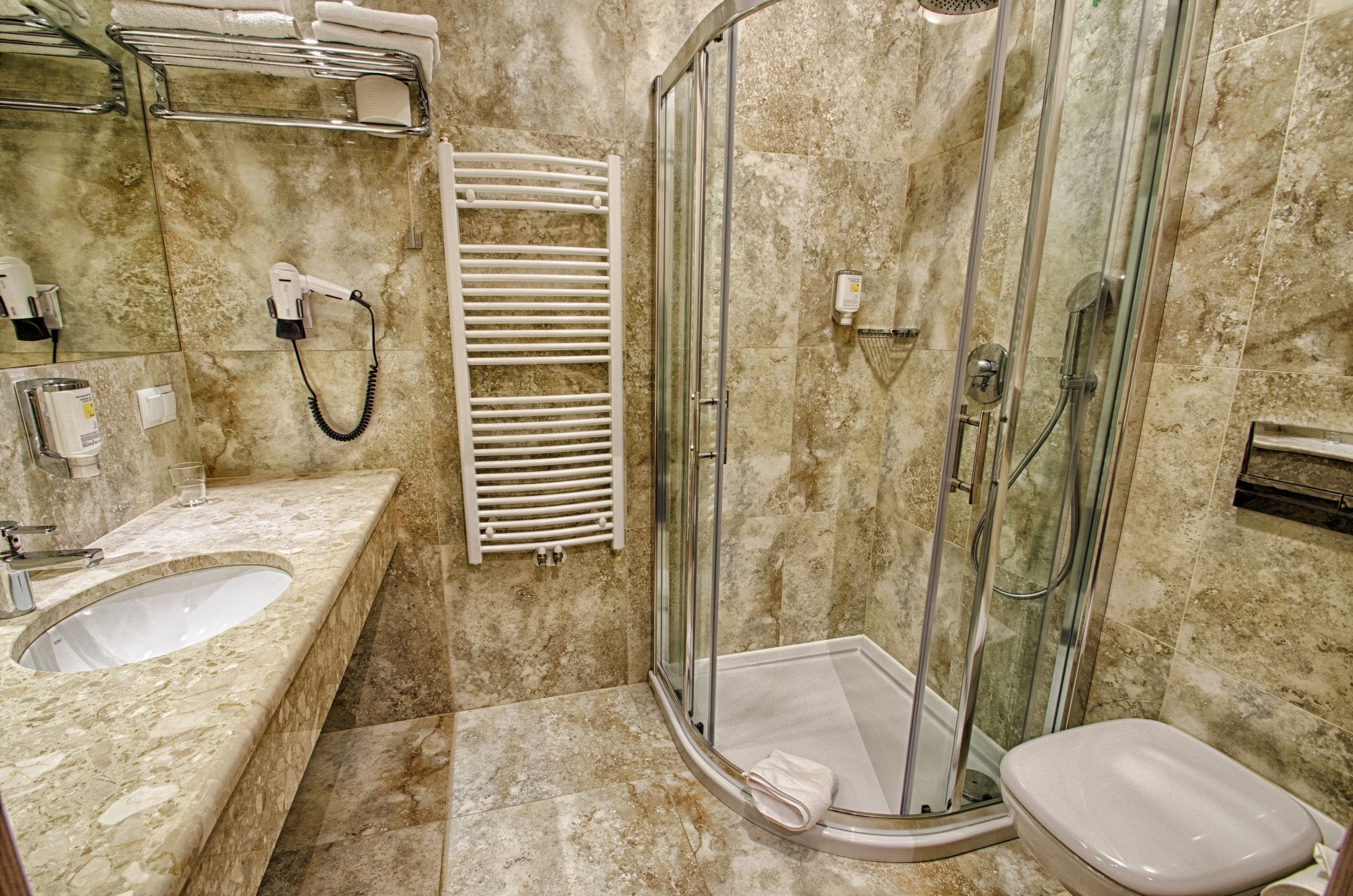 deep-soaking bathtub, hair dryer, towels