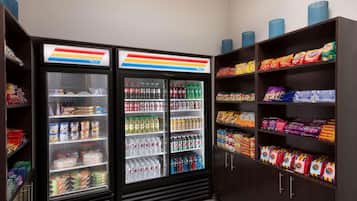 A vending machine area with snacks and beverages.