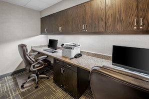 A modern office space with a desk, chair, printer, and computer monitor. - Hampton Inn & Suites Camp Springs/Andrews AFB (Suitland)