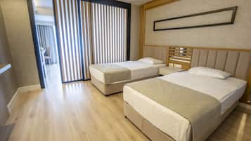 Family Room | Free minibar, in-room safe, free cribs/infant beds, WiFi