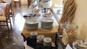 A buffet setup with various food items and condiments. - Hotel Sogno del Benaco (Limone sul Garda)