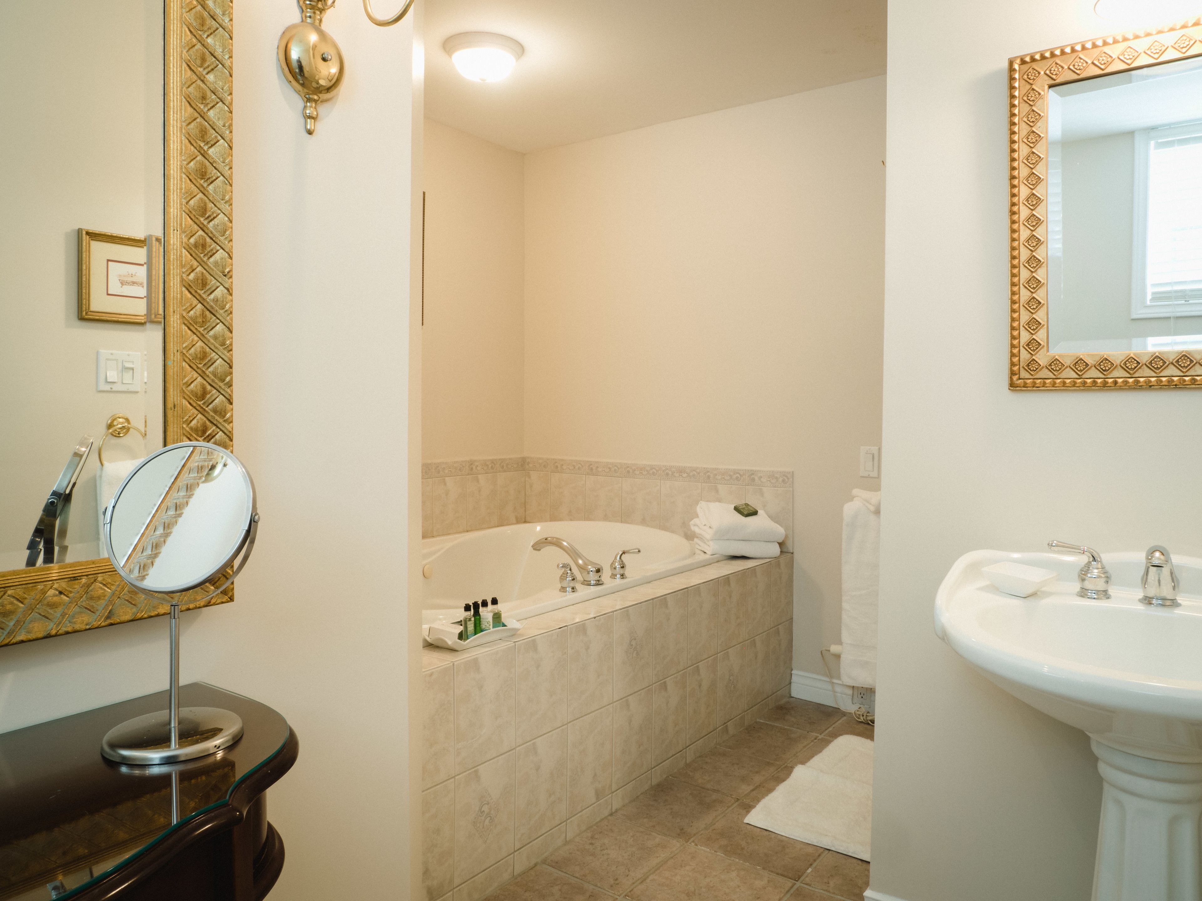 signature suite | bathroom | combined shower/bathtub, designer toiletries, hair dryer, towels