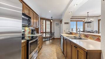 Equinoxe 172-1 , 3 Bedrooms | Private kitchen | Full-sized fridge, microwave, stovetop, dishwasher