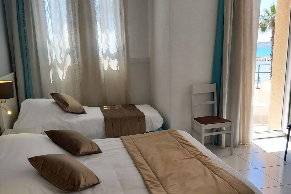 Quadruple Room, Sea View | Minibar, in-room safe, desk, blackout drapes