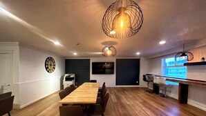 A modern kitchen with a wooden countertop, a built-in oven, and a sink. - Big Lake Inn (Slave Lake)
