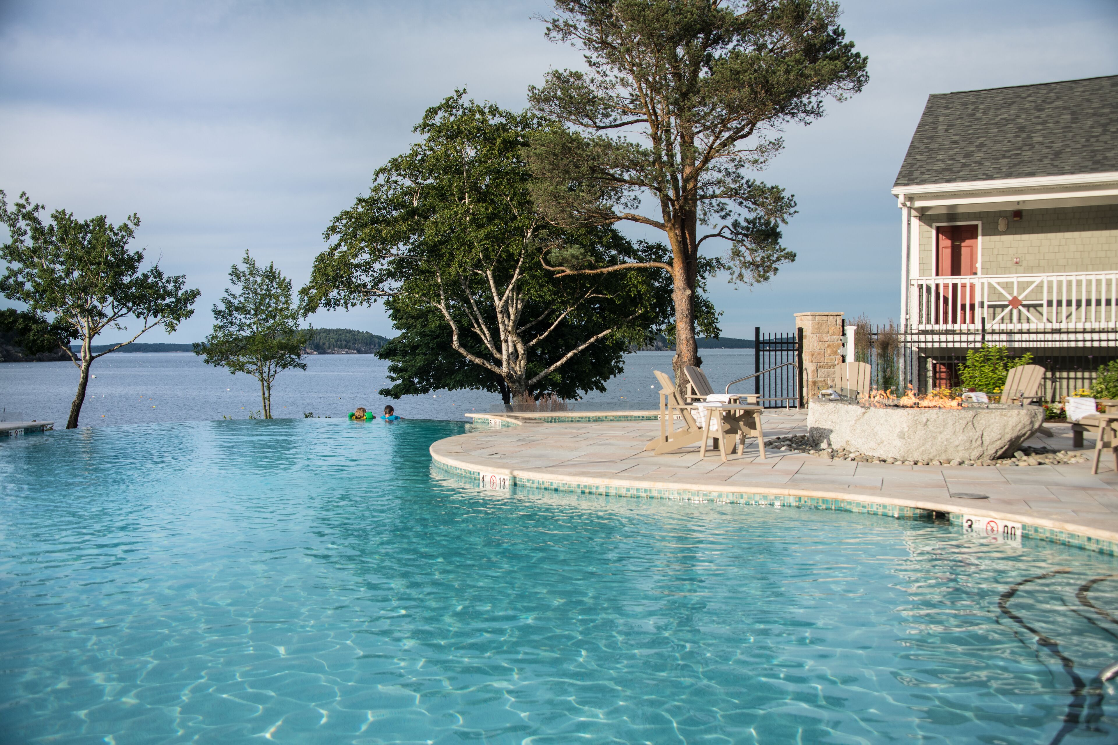 seasonal outdoor pool, pool umbrellas, pool loungers