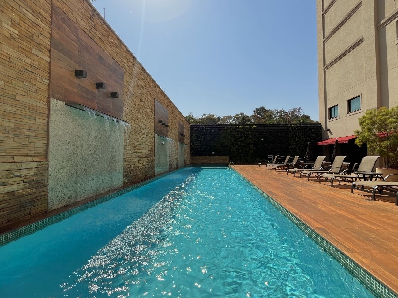 outdoor pool, open 6:00 am to 6:30 pm, pool umbrellas, pool loungers