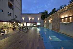 Outdoor pool, open 6:00 AM to 6:30 PM, pool umbrellas, sun loungers