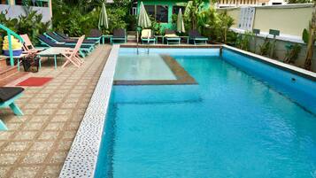 Outdoor pool, pool umbrellas, pool loungers