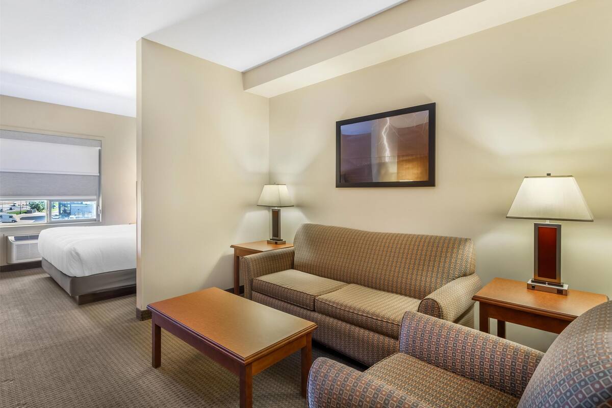 Premium bedding, desk, laptop workspace, blackout curtains