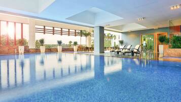 Relax by the pool with a clear view of the surrounding landscape.