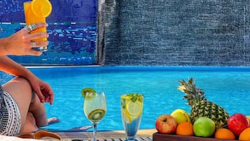 Outdoor pool, open 7 AM to 8 PM, pool umbrellas, sun loungers