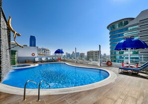 Outdoor pool, open 7 AM to 8 PM, pool umbrellas, pool loungers