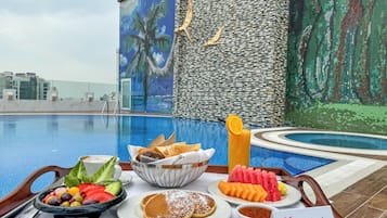 Outdoor pool, open 7 AM to 8 PM, pool umbrellas, pool loungers