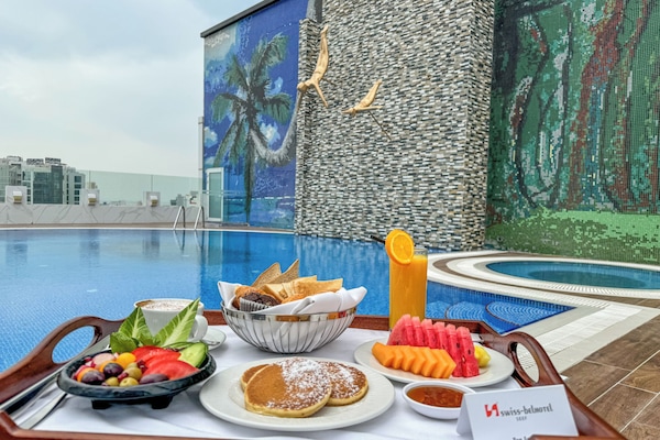 Outdoor pool, open 7 AM to 8 PM, pool umbrellas, pool loungers