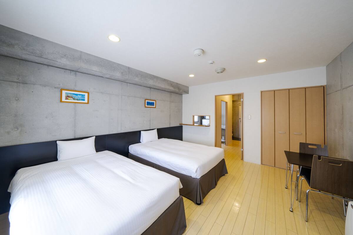 Premium bedding, desk, laptop workspace, blackout curtains