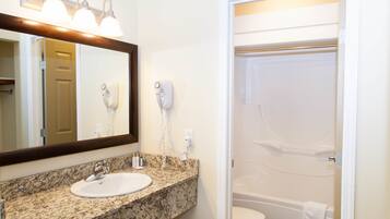 Superior Suite, 1 King Bed | Bathroom | Hair dryer, towels