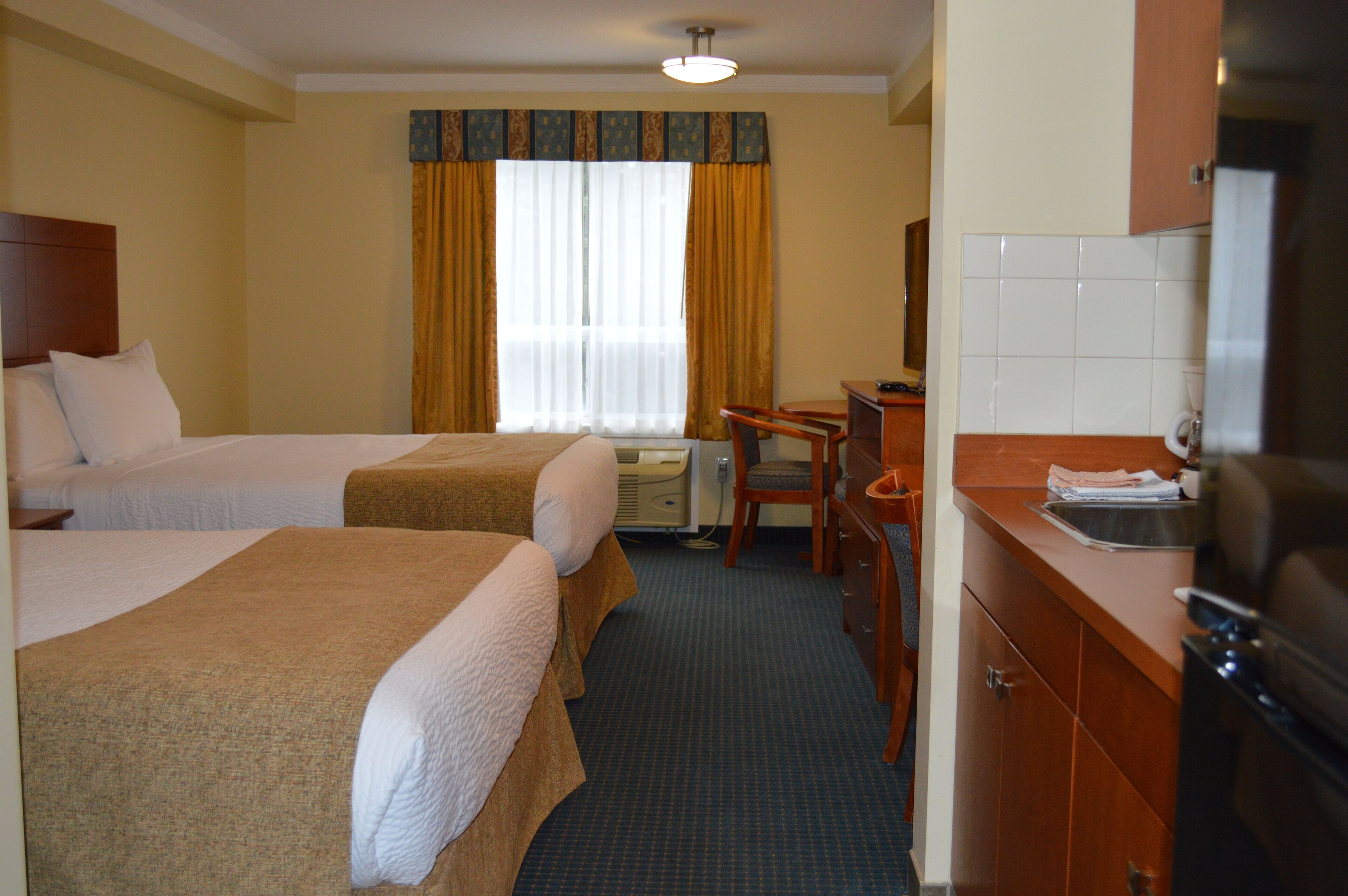 standard room, 2 queen beds, kitchenette | iron/ironing board, free wifi, bed sheets, wheelchair access