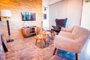 Penthouse presidencial, 1 cama Queen size, para fumadores, vista a la ciudad | Área de sala de estar